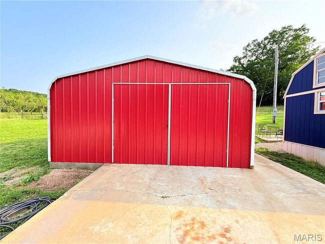 View of pole building with a yard | Image 7