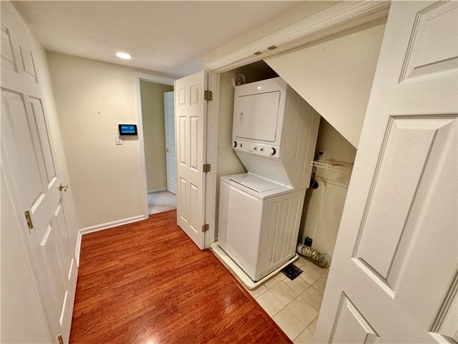 First floor laundry is located in the hallway. | Image 16