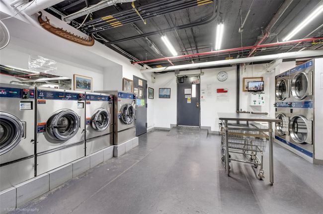 Common laundry area featuring washing machine and dryer and stacked washer and dryer | Image 10