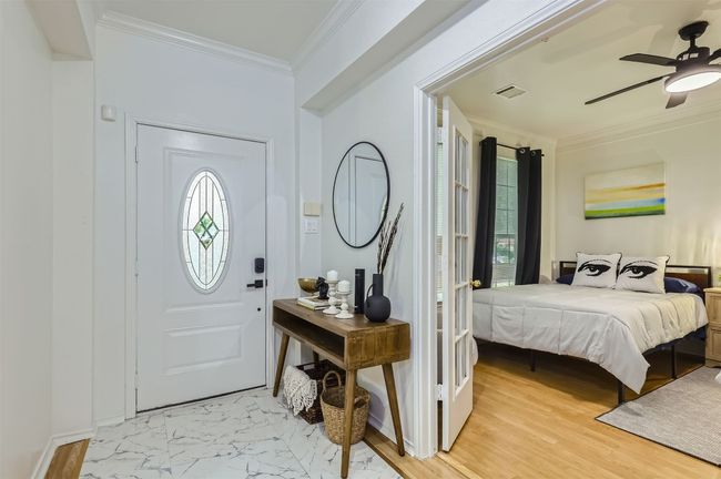 Entryway featuring a ceiling fan, plenty of natural light, and ornamental molding | Image 24