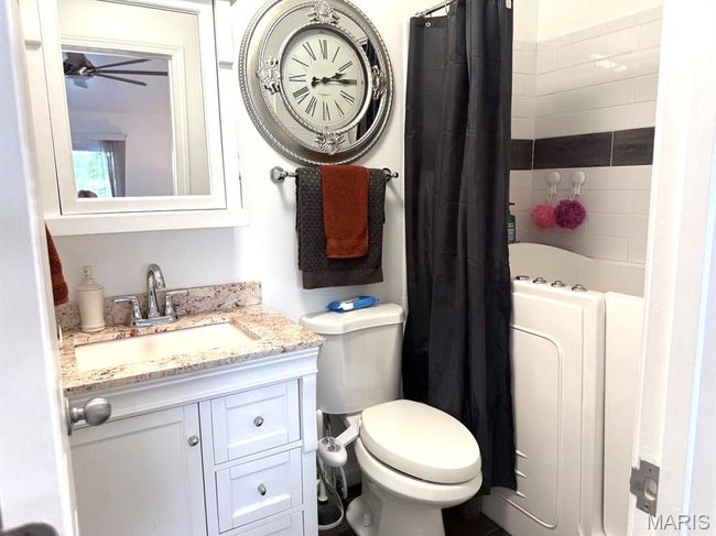 Full bath featuring vanity, ceiling fan, and toilet | Image 26