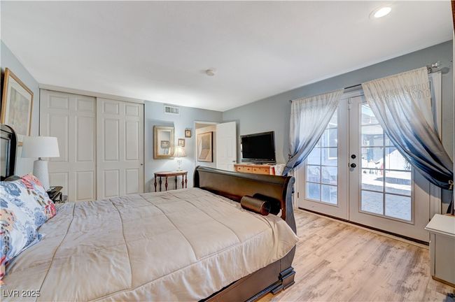 Bedroom featuring access to outside, french doors, light wood-style floors, and a closet | Image 42