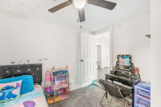 bedroom featuring carpet and a ceiling fan | Image 16