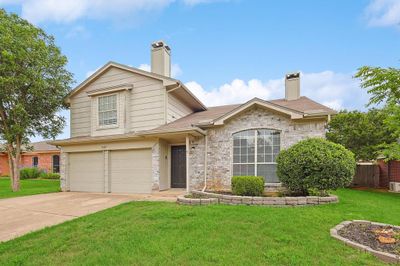 View of front of house featuring a garage and a front yard | Image 3