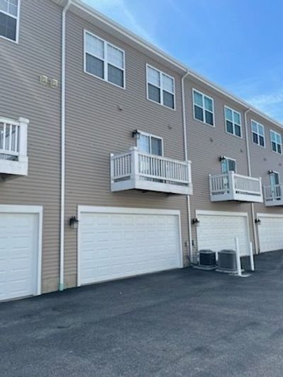 View of garage and balcony off of kitchen. | Image 3