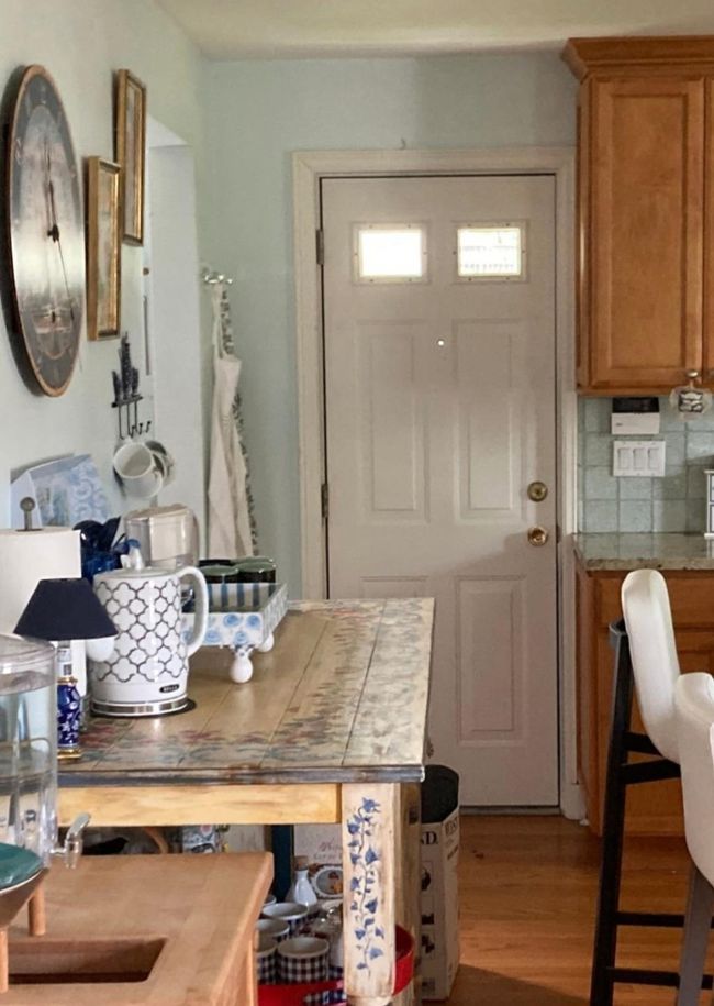 Kitchen with stove, backsplash, brown cabinets, a breakfast bar area, and hanging light fixtures | Image 15