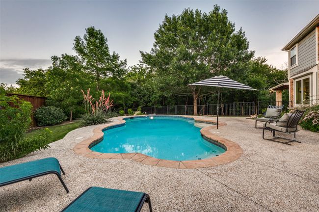 Another view of pool looking toward back covered patio | Image 6