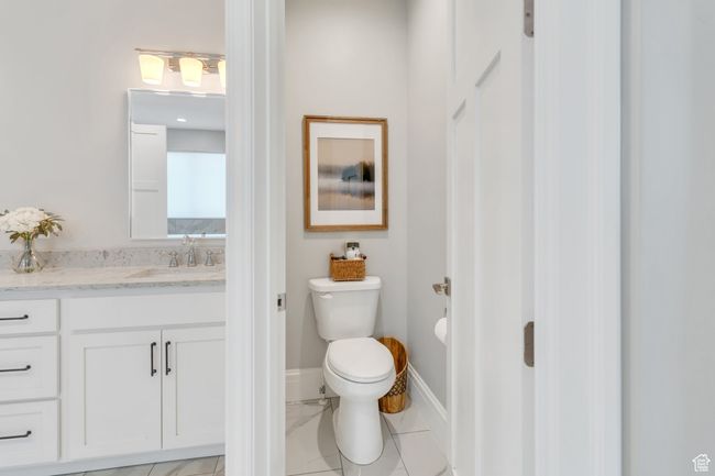 Bathroom featuring vanity and toilet | Image 33