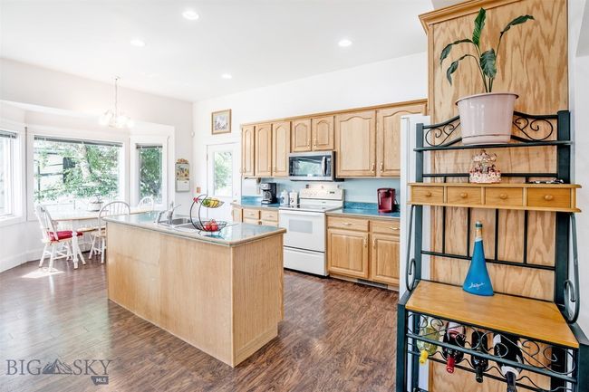 kitchen, island with sink, dining area | Image 8