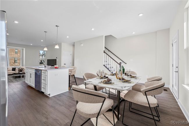 Dining area with baseboards, stairs, dark wood finished floors, and recessed lighting | Image 5