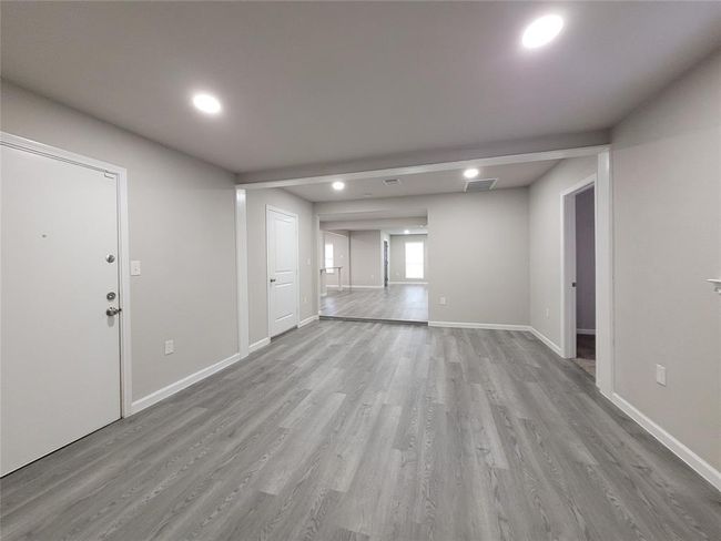 Flex room looking towards the Living room. to the left is an exterior door to the patio and garage. | Image 22