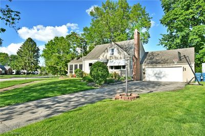 View of front facade featuring a garage and a front lawn | Image 3