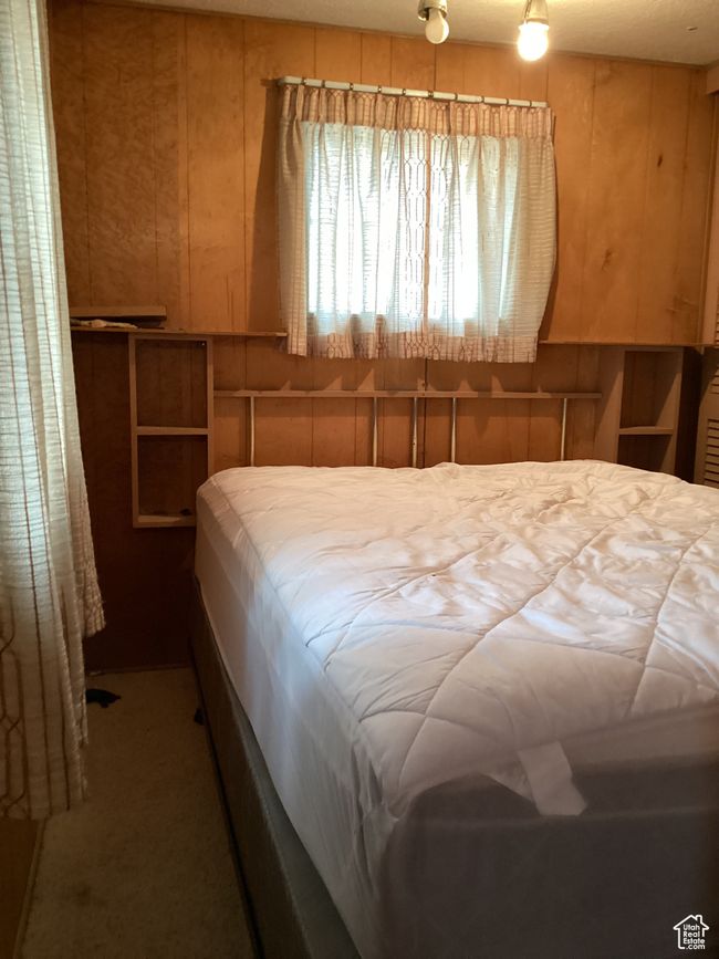 Bedroom with wood walls | Image 21