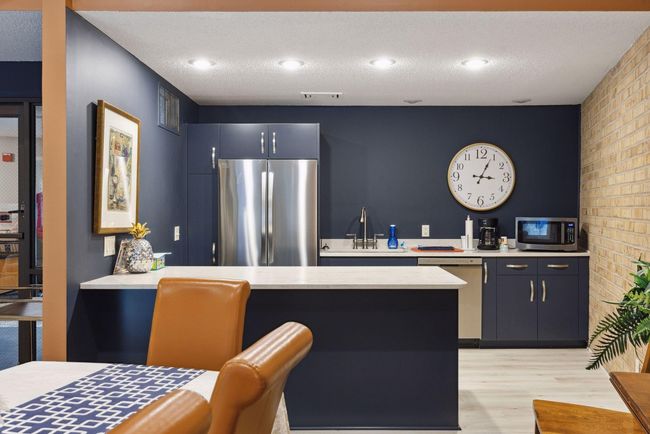 Community party room featuring a full kitchen, making entertaining and hosting effortless and convenient | Image 14
