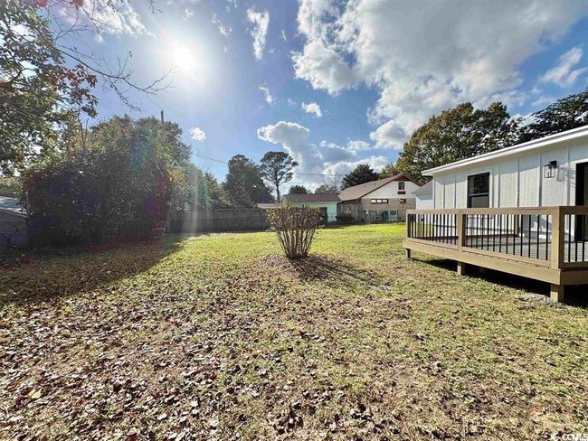 View of yard with a deck | Image 34