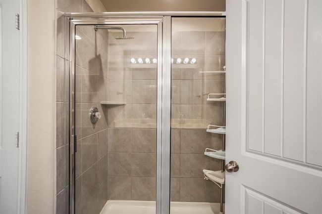 A large tiled separate shower is in the primary en-suite. | Image 24