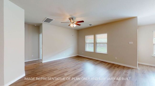 Unfurnished room with a ceiling fan, light wood finished floors, and baseboards | Image 12