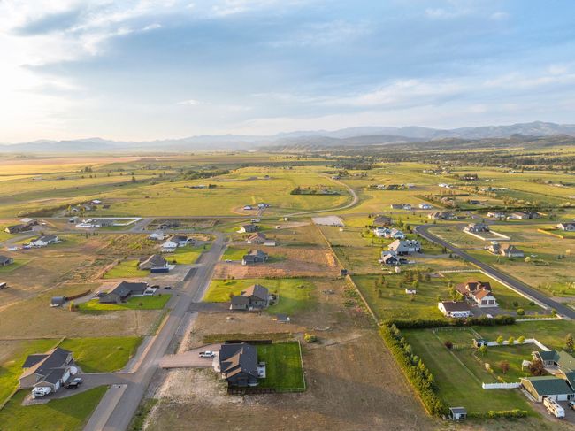 Aerial overview of property's location with a mountain backdrop | Image 37