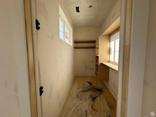 Basement featuring a textured ceiling | Image 20