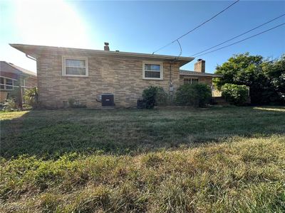 Back of property with central AC and a lawn | Image 2