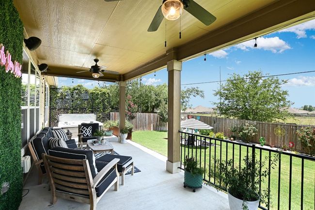 View of patio featuring ceiling fan and grilling area | Image 34