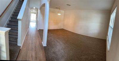 Basement featuring crown molding and hardwood / wood-style floors | Image 2