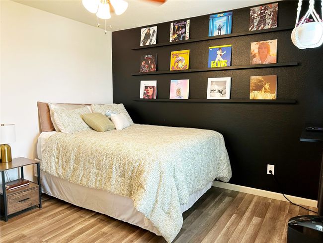 Upstairs secondary bedroom with accent wall. There is a full bathroom just outside of the room. | Image 26