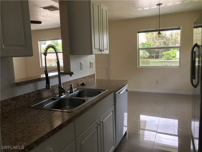 5615 Birdsong Ln, Home with 4 bedrooms, 2 bathrooms and null parking in BOKEELIA FL | Image 12