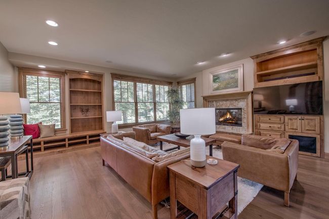 Head into the warm and inviting living room in the heart of the home! | Image 5
