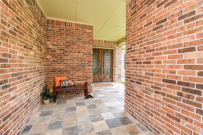 Inviting covered porch entry offers a breezeway of comfort! | Image 6