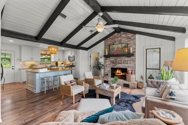 WOW! This open concept living room and kitchen ARE straight out of a magazine! These pictures don't lie...this home truly looks like this in person! | Image 10