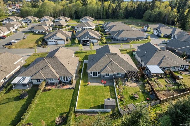 Middle of picture, red chairs and white fence. Please note, property extends to second fence. | Image 42