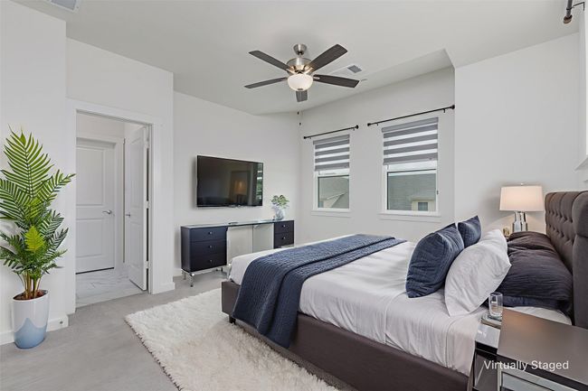 Bedroom featuring ceiling fan and baseboards | Image 14