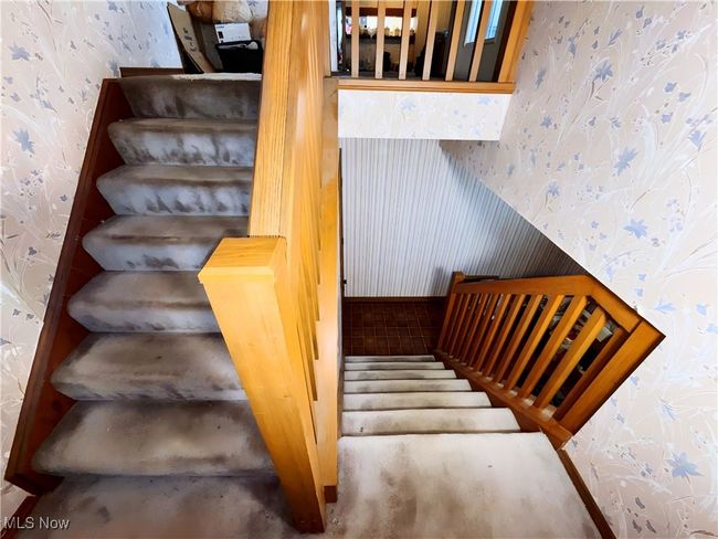 Staircase featuring wallpapered walls | Image 6