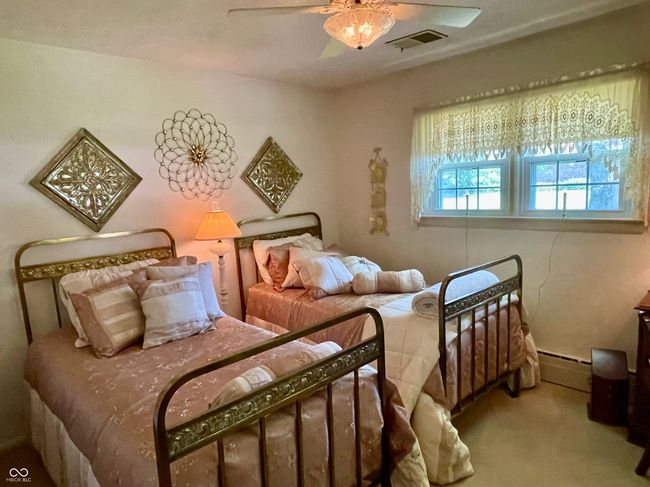 bedroom 4 featuring a baseboard heat, carpet, and a ceiling fan | Image 35