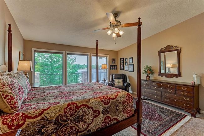 The upstairs location of the primary bedroom maximizes stunning water views. | Image 20