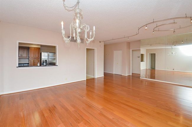 The dining area flows into the kitchen in living room. | Image 8