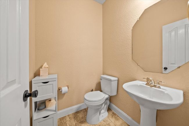 Bathroom featuring toilet and baseboards | Image 11