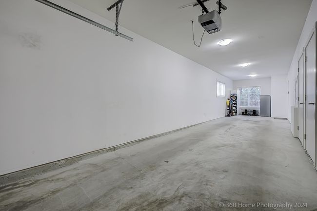Garage featuring a garage door opener | Image 30