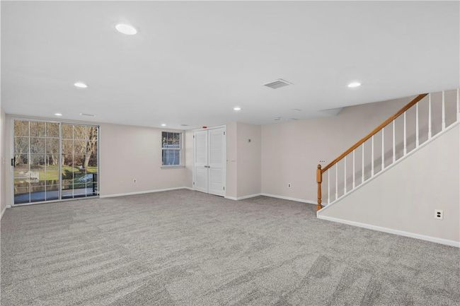 Finished walk-out basement with doors to patio. | Image 12