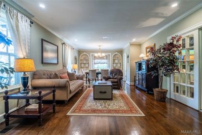 Separate entry leading into the formal living and dining rooms. Beautiful refinished hardwood flooring, crown molding, and smooth ceilings. | Image 3