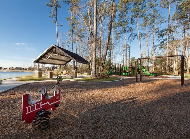 Enjoy family-friendly amenities with a well-equipped playground and a spacious picnic area, perfect for outdoor gatherings and fun. | Image 21