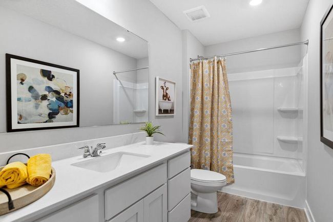 The second bath has a tub and is perfect for guest, or just relaxing! Photo of a similar layout model home, layout and colors will vary. | Image 8