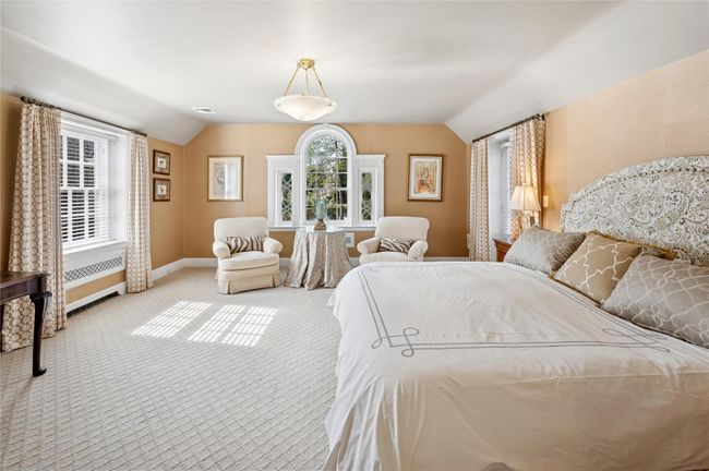 Well-appointed Primary Suite with decorative window molding | Image 22