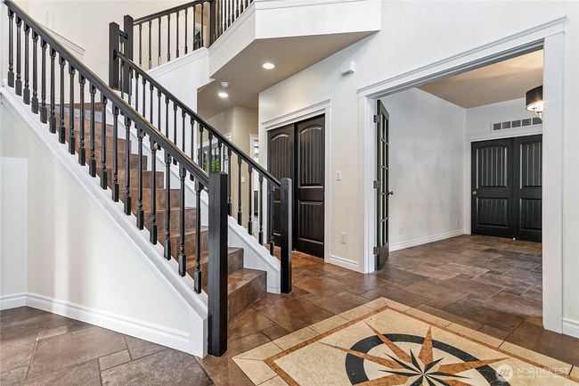 Let's head upstairs to the primary bedroom with en suite bath and walk-in closet, two guest bedrooms, and a full guest bathroom. | Image 14