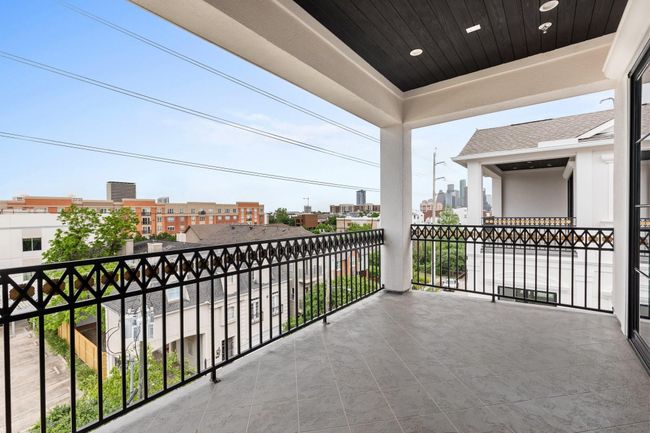 Elegant sliding glass doors blur the line between indoor and outdoor living, connecting the game room with the terrace. | Image 37