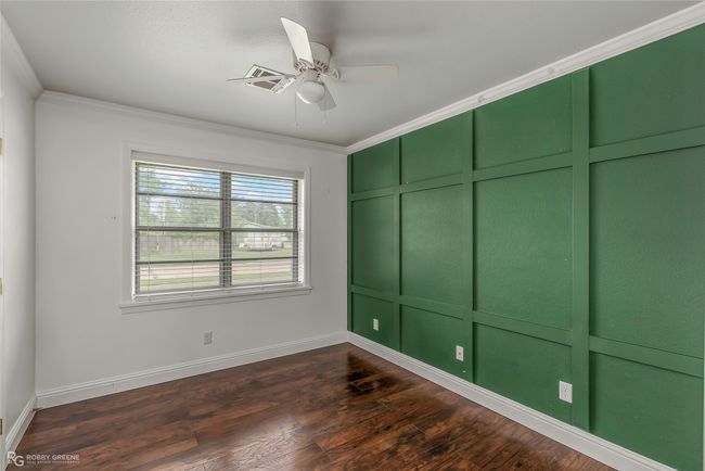 Spare room featuring baseboards, ornamental molding, and a ceiling fan | Image 10