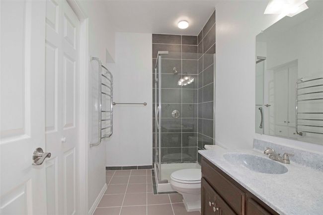 Updated Primary Bath with corner Shower, new mirror, and new closet doors with walk-in closet. | Image 28