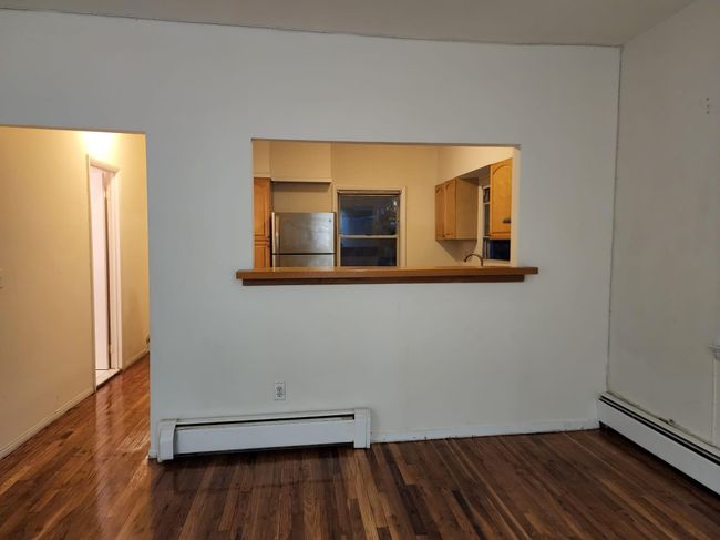 Living room with window bar to kitchen | Image 13
