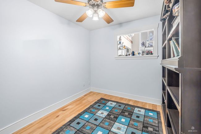 Spare room with baseboards, light wood-type flooring, and a ceiling fan | Image 18